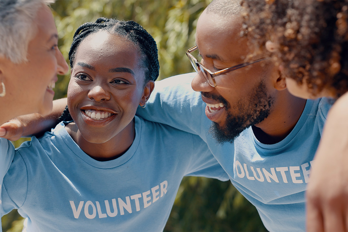 T-shirt worn by volunteers, symbolizing commitment to helping families recover from trauma and giving back to the community.